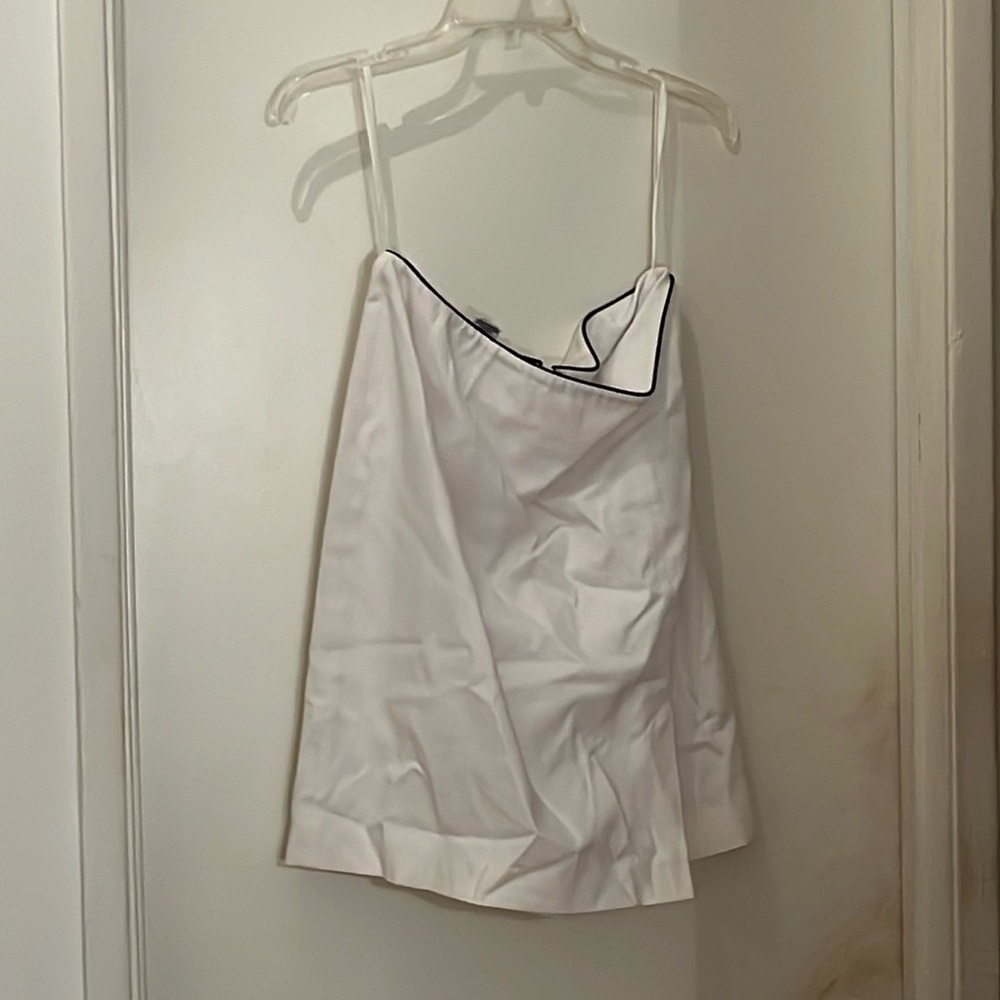 White suit with black piping